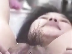 Korean slut with large pussy and pouty lips gets naughty on camera. She stuffs her hairy pussy with fingers, metal balls and even a bottle. This cunt can swallow a lot of jizz too!